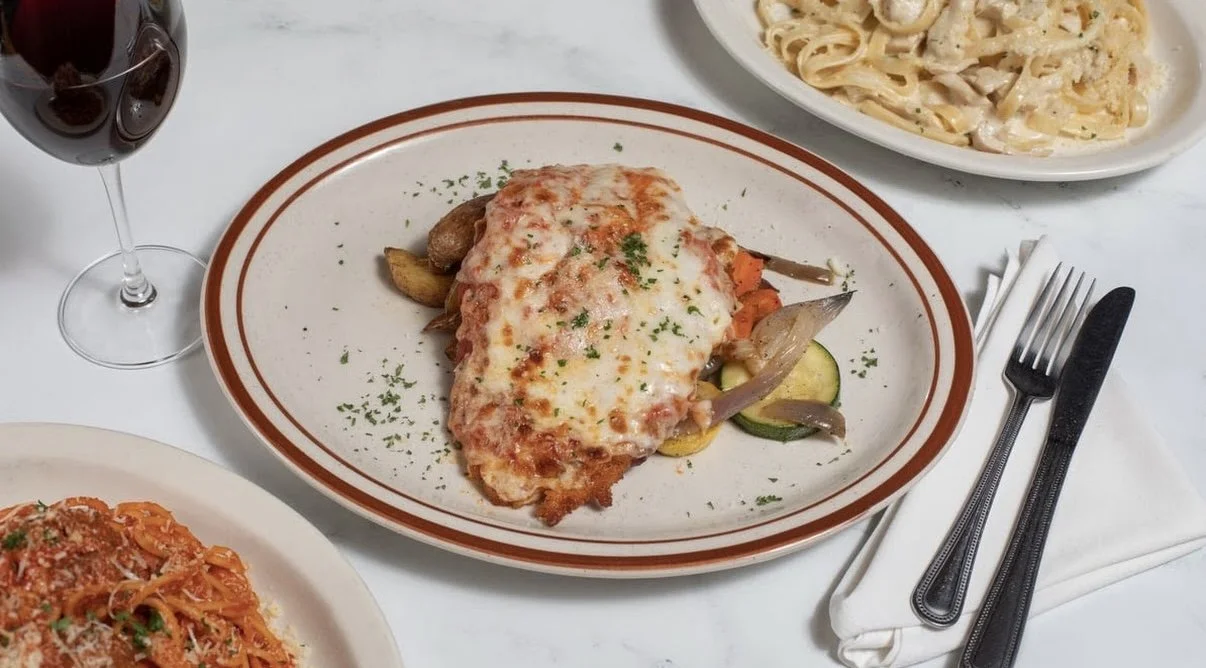 Chicken Parmigiana with melted cheese and roasted vegetables