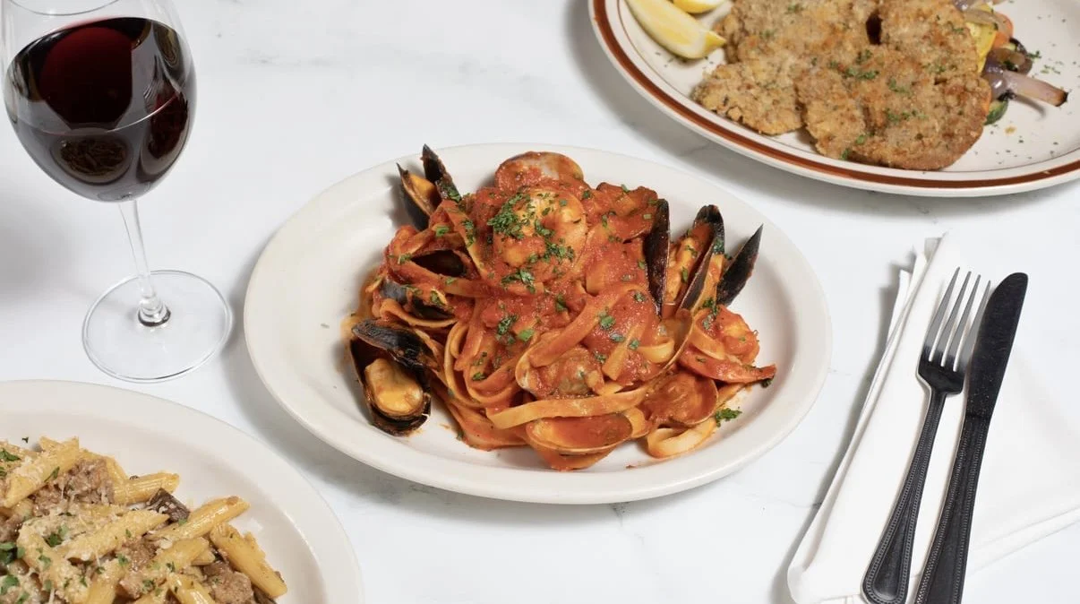 Seafood pasta and Italian dishes arranged for a table